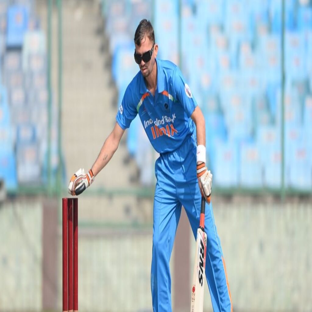 Blind Indian batsman Ketan Patel feels for the wicket during the T20 cricket World Cup for the Blind event at the Feroz Shah Kotla Stadium in New Delhi on February 1, 2017. / AFP PHOTO / SAJJAD HUSSAIN